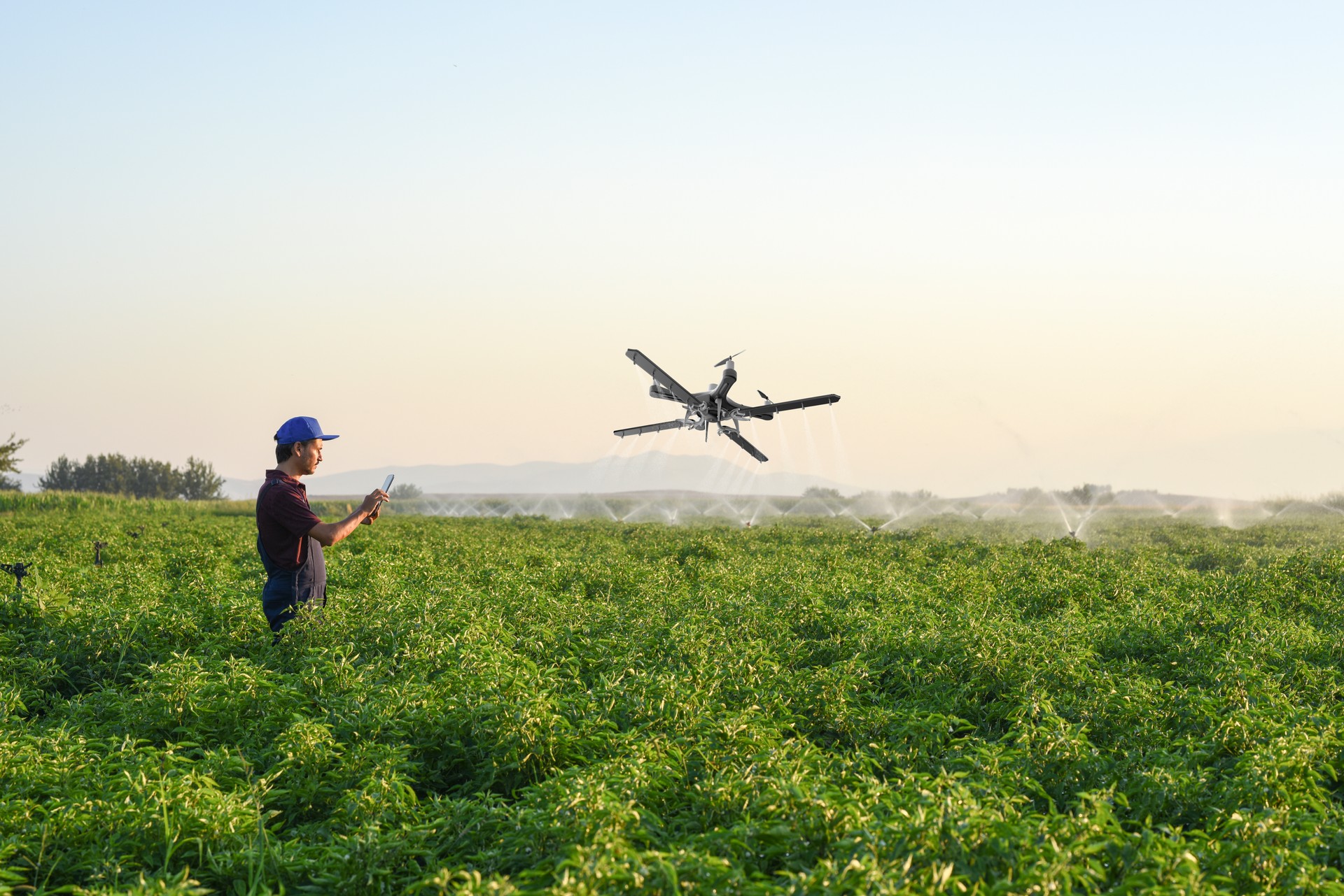 Farmer operating smart-farming drone